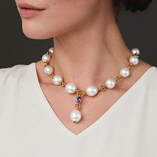 Model wearing Pearl Y Necklace in South Sea pearl, sapphire, and gold