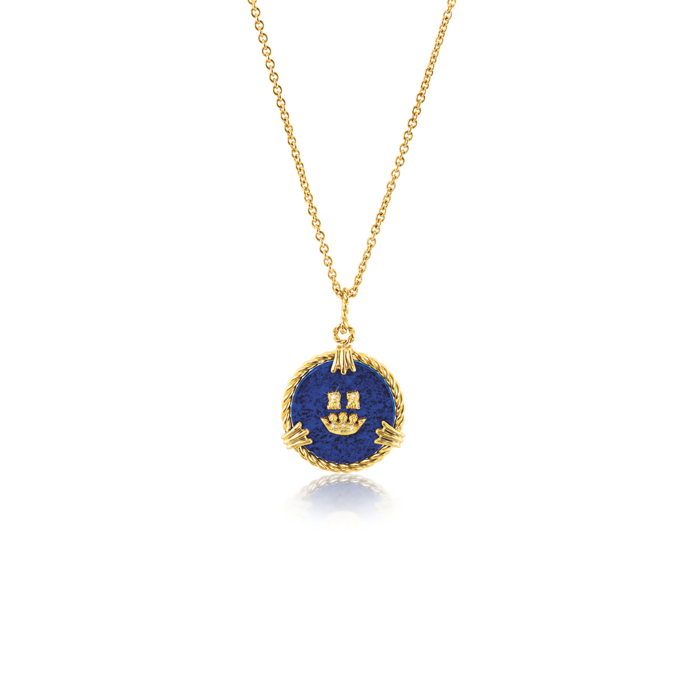 Verdura Coronet Charm Necklace in lapis, gold, and diamonds on a 17-inch chain, inspired by Verdura’s 1939 coat of arms logo, with an engraveable gold disc on the back