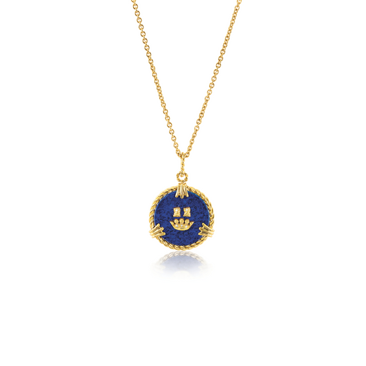 Verdura Coronet Charm Necklace in lapis, gold, and diamonds on a 17-inch chain, inspired by Verdura’s 1939 coat of arms logo, with an engraveable gold disc on the back