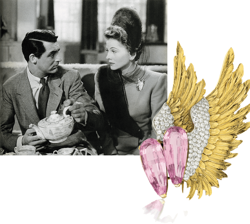 Cary Grant in scene from Suspicion, with joan fontaine, wearing Verdura's pink tourmaline wing brooch