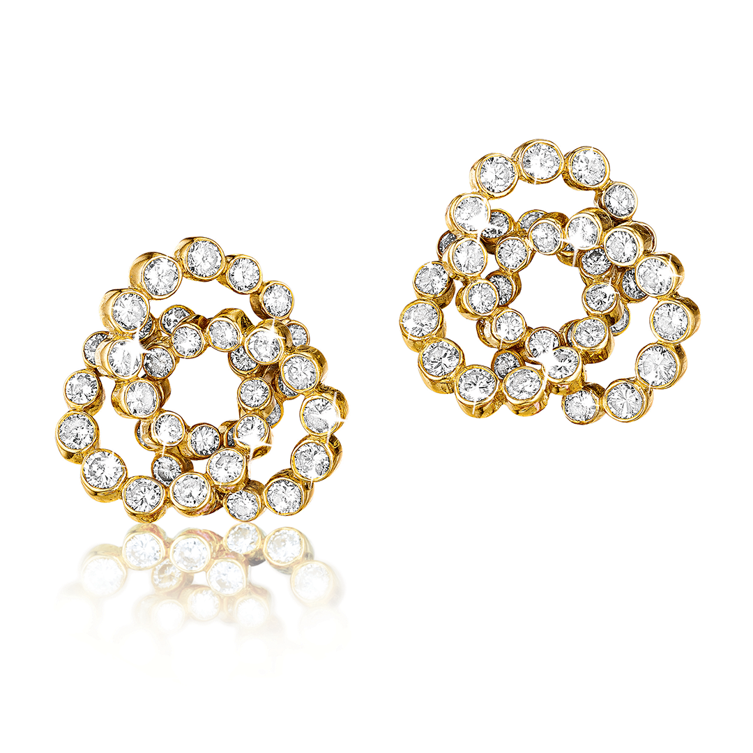Trefoil earclips in gold and diamond